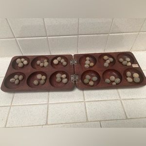 Handcarved mancala or oware game